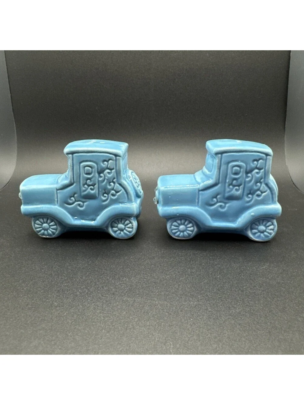 N/A add a dash of vintage charm to your dining experience with these ceramic blue car salt and pepper shakers  originating from japan in the 1960s
